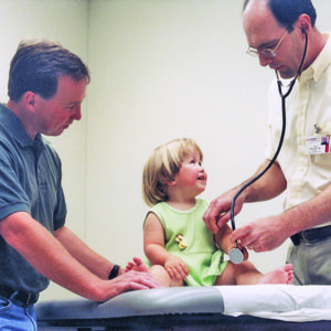 David Wargowski, MD, with patient and parent
