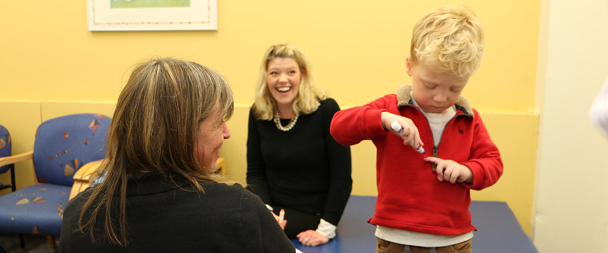 Jayden with Mom at Waisman NBFU clinic