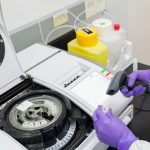 Bryan Atkinson evaluates cell culture medium using a bioanalyzer. Photo by Todd Brown, UW–Madison