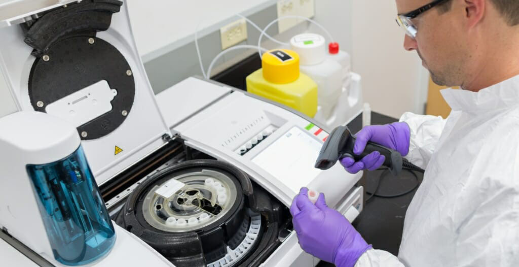 Bryan Atkinson evaluates cell culture medium using a bioanalyzer. Photo by Todd Brown, UW–Madison