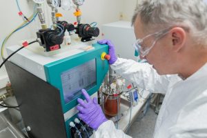 Waisman Biomanufacturing staff member Alan Bettermann optimizing bioreactor process at small scale. 