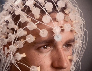 Man demonstrating Electroencephalogram (EEG) recording system 