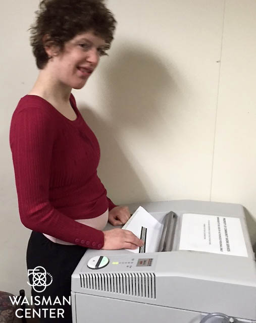 Rachel Karch works shredding documents at the Department of Natural Resources