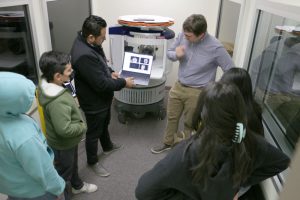 José Guerrero and Doug Dean scanned a pineapple to demonstrate the use of a portable magnetic resonance imaging scanner.